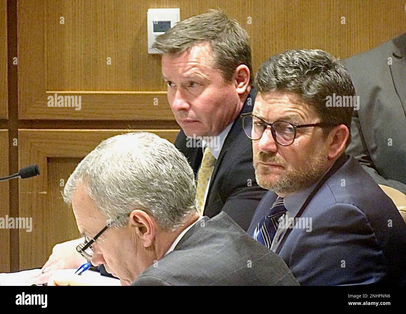 State Division of Criminal Investigation Agent Mark Wagner, center