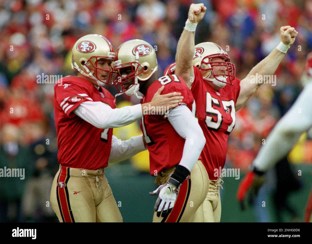 49ERS RICHEY/C/08NOV98/SP/MAC 49ers celebrate after 7-Wade Richey, left  hits a 46 yard field goal to put the niners ahead in the 4th quarter.  81-Terrell Owens and 57-Randy Kirk join the celebration. by