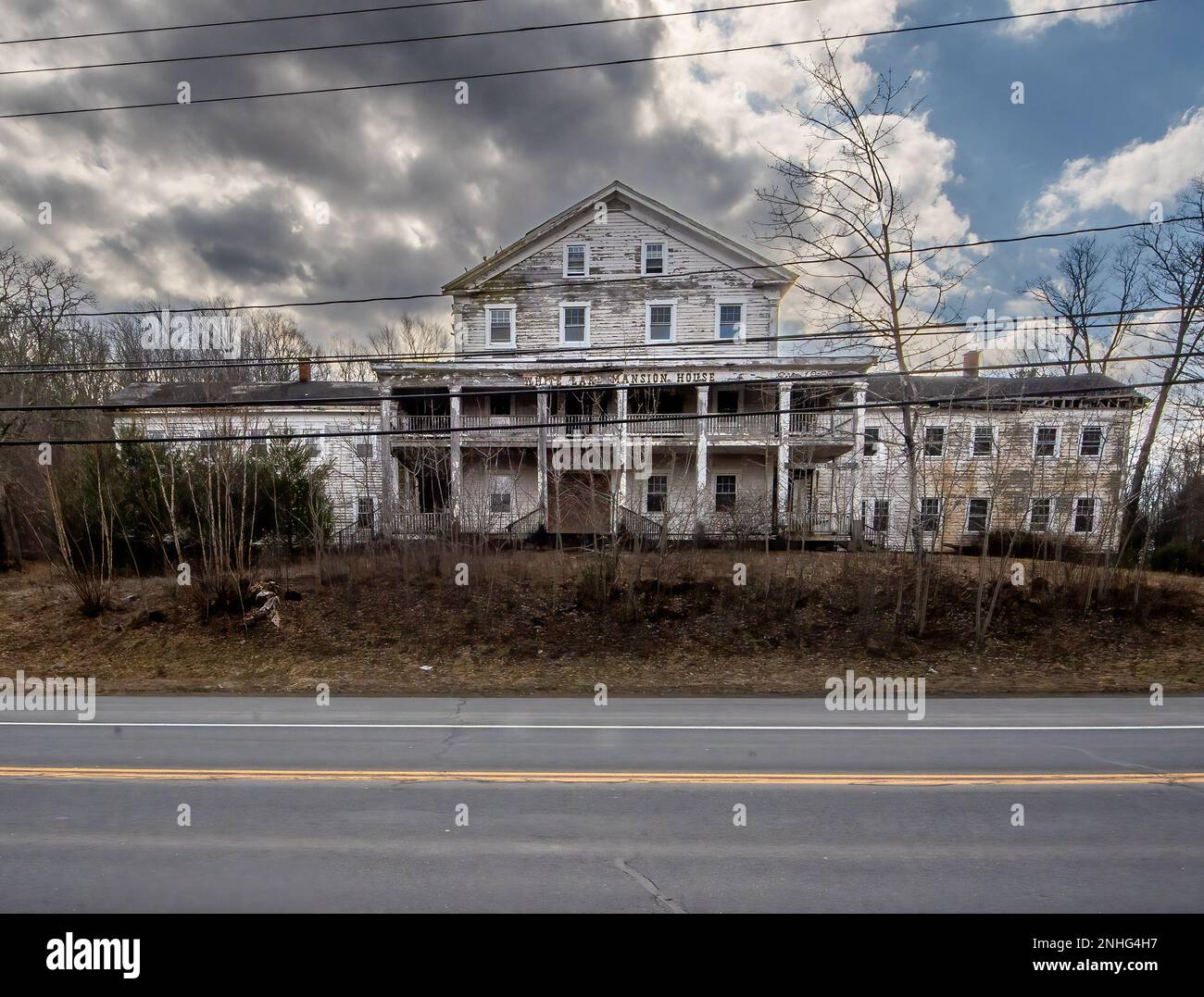 White Lake, NY USA Feb 20, 2023 Horizontal view of the rotting wooden ruins of the White