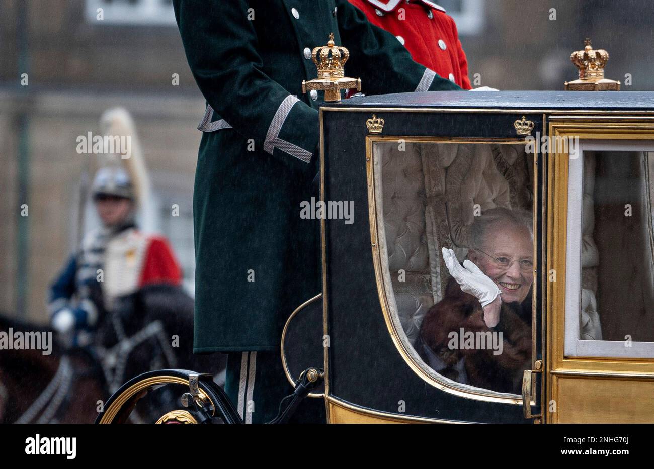 Denmark's Queen Margrethe is escorted by the Guard Hussar Regiment's