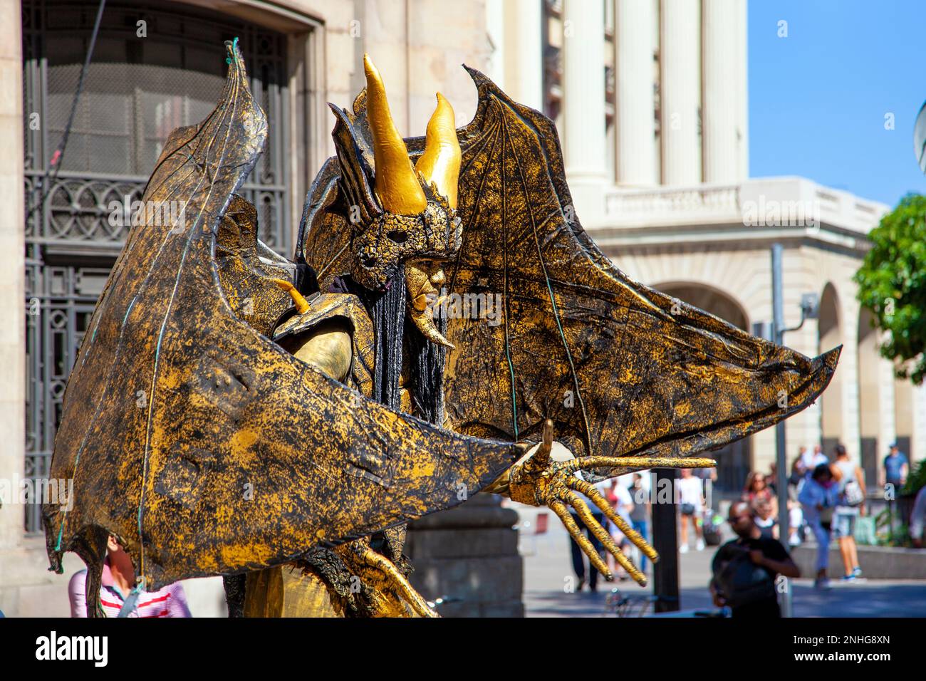 Golden gargoyle demon living statue performer on La Rambla, Barcelona, Catalonia, Spain Stock Photo