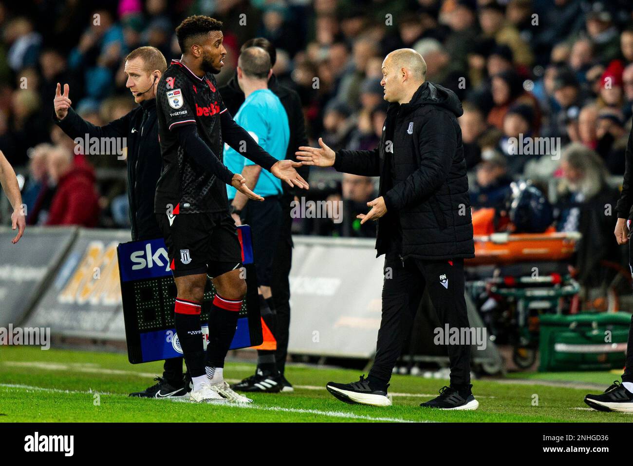 Swansea, UK. 21st Feb, 2023. Tyrese Campbell of Stoke City (L) appeals to Stoke City manager Alex Neil (R) after being substituted. EFL Skybet championship match, Swansea city v Stoke City at the Swansea.com Stadium in Swansea, Wales on Tuesday 21st February 2023. this image may only be used for Editorial purposes. Editorial use only, license required for commercial use. No use in betting, games or a single club/league/player publications. pic by Lewis Mitchell/Andrew Orchard sports photography/Alamy Live news Credit: Andrew Orchard sports photography/Alamy Live News Stock Photo