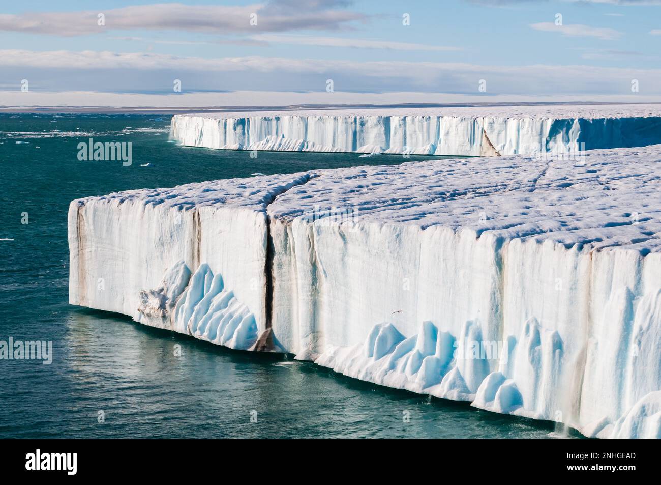 Water pouring off the arctic ice shelf of the Svalbard Islands of
