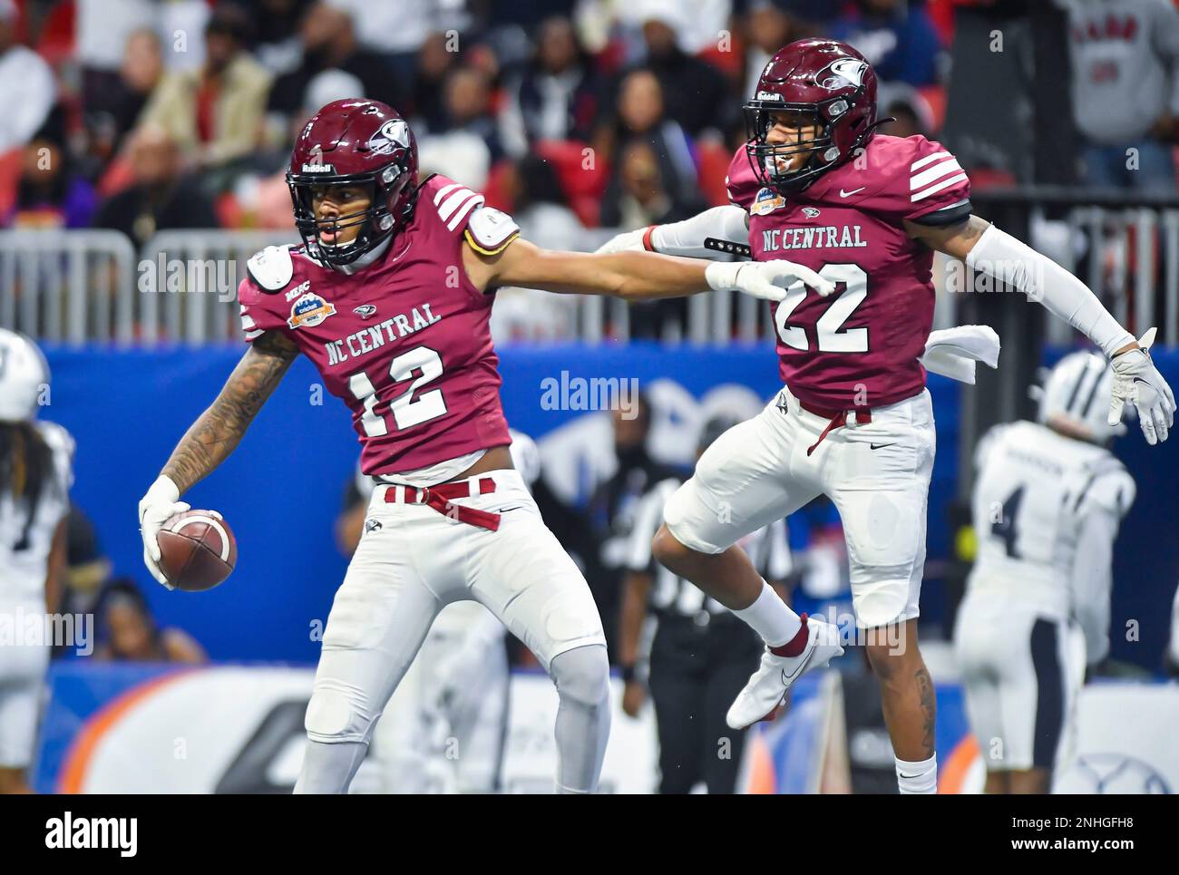 ATLANTA, GA - DECEMBER 17: North Carolina Central Eagles receivers Quentin  McCall (12) and Devin Smith (22) celebrate after a third quarter touchdown  in the college football Cricket Celebration Bowl between the