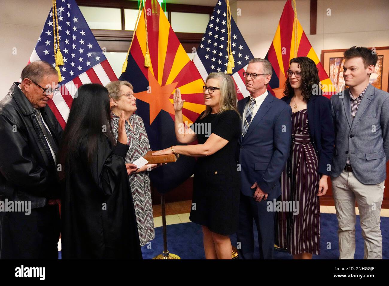 The new Arizona Democratic Gov. Katie Hobbs, middle, takes the oath of ...