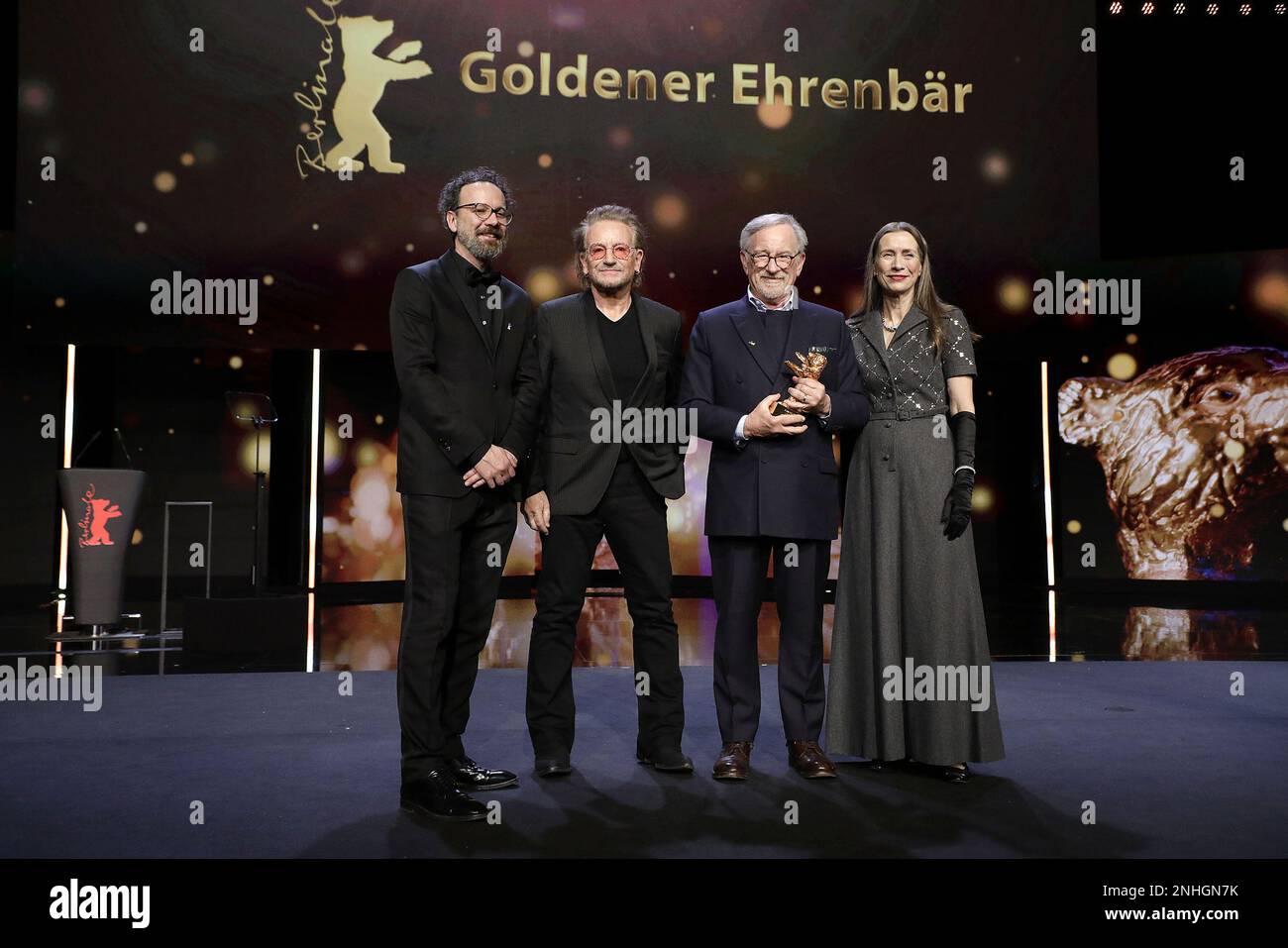 „U2“ Singer Bono Carlo Chatrian, „U2“ singer Bono, Steven Spielberg and Mariette Rissenbeek seen on stage at Honorary Golden Bear Award and homage for Stock Photo