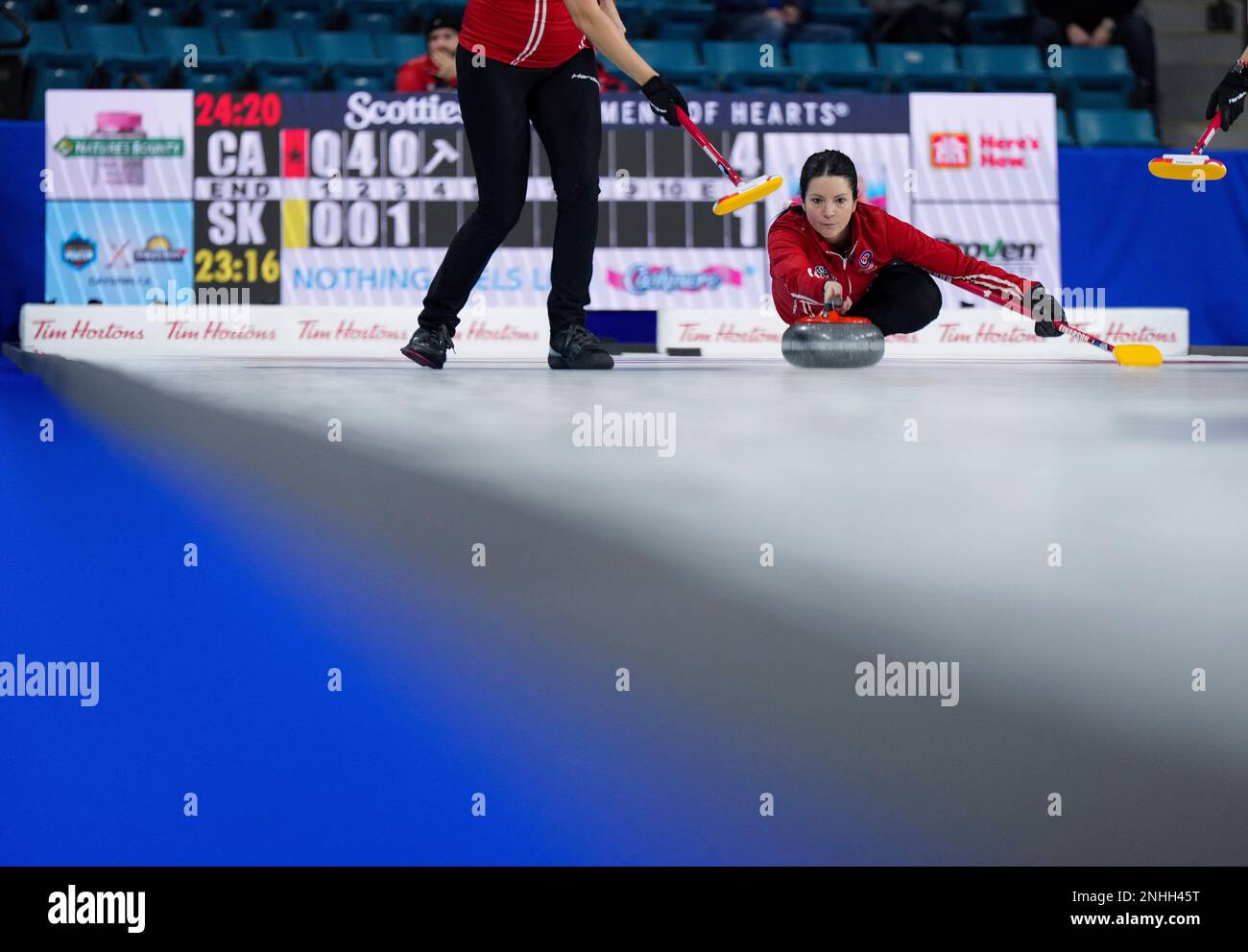 Team Canada skip Kerri Einarson delivers her last rock in the fourth