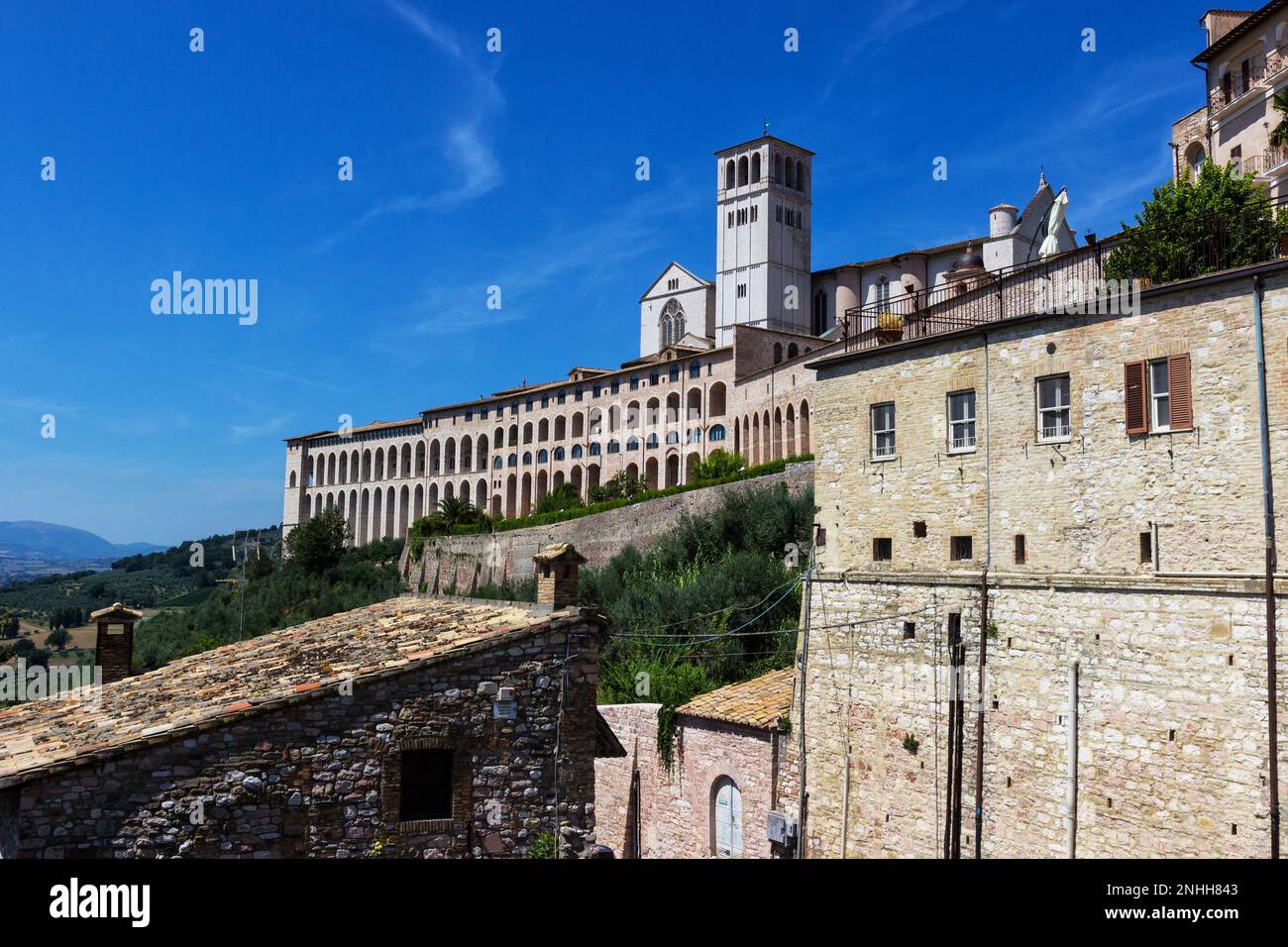 View from the outside of the imposing Basilica of San Francesco in Assisi Stock Photo