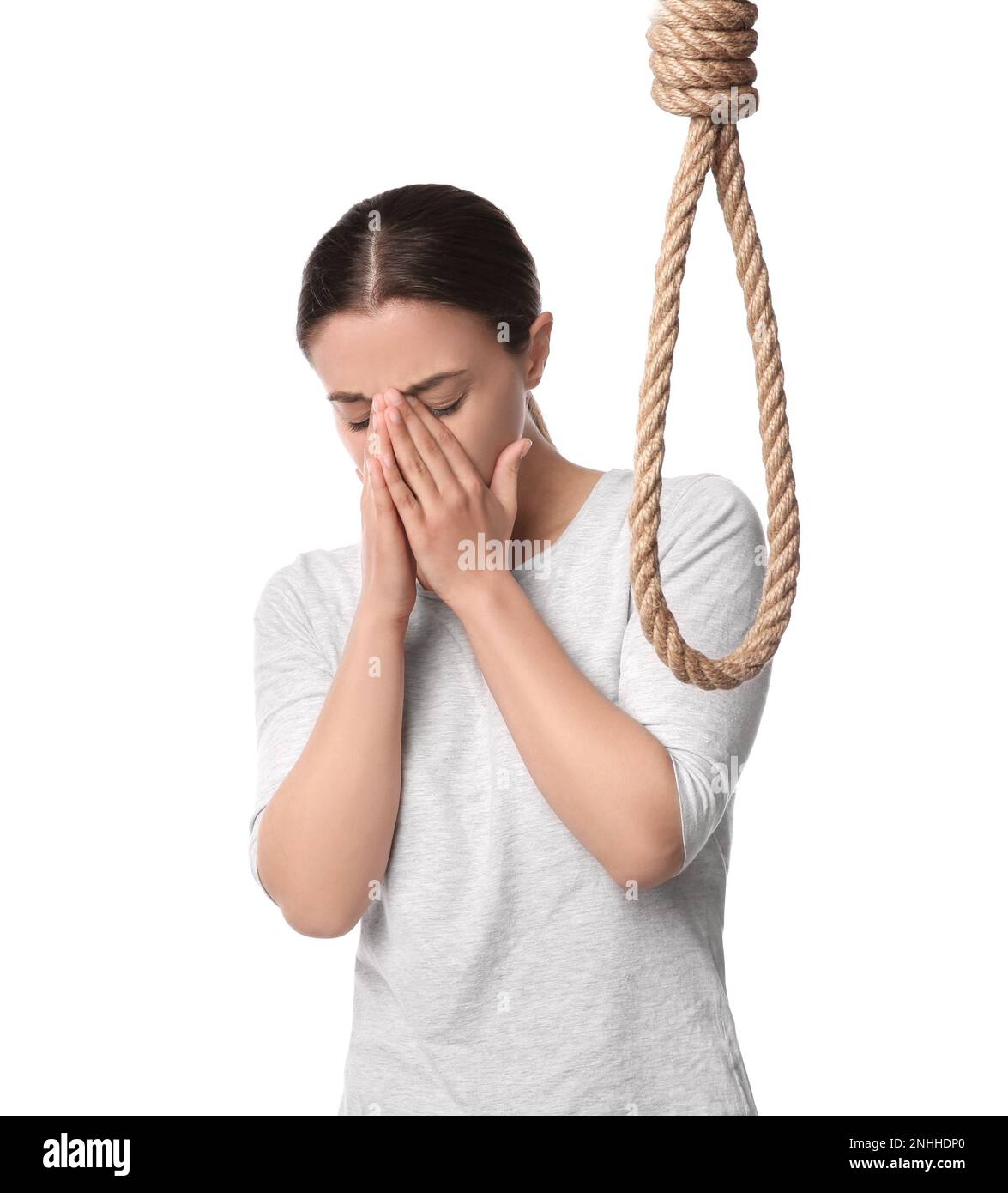 Depressed woman with rope noose on white background Stock Photo