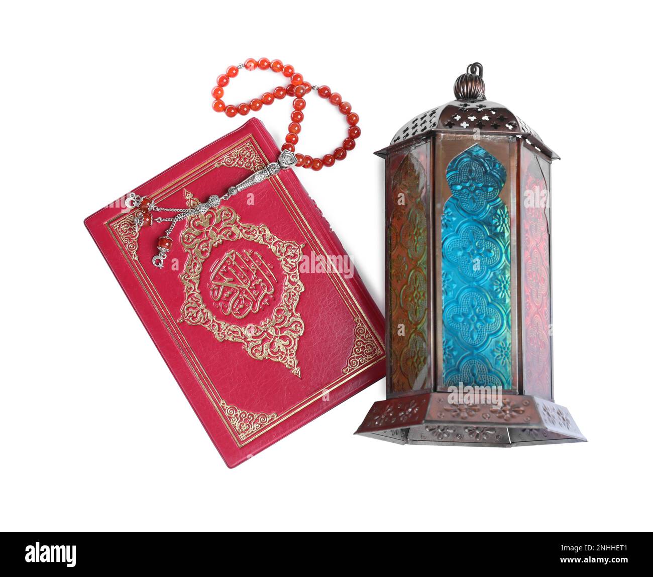 Decorative Arabic lantern, Quran and misbaha on white background, top