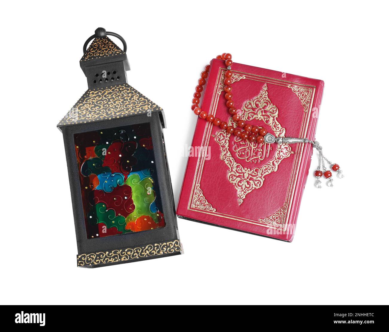 Decorative Arabic lantern, Quran and misbaha on white background, top