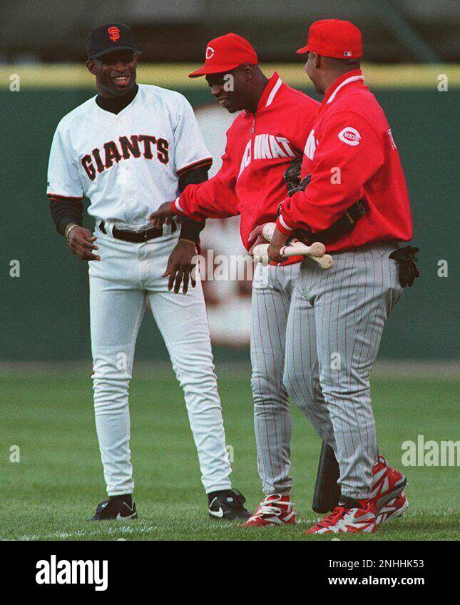 SANDERS/26JUL95/SP/MACOR Giant's newest addition to the team Deion Sanders  jokes around with a few of his former teamates before the start of last  nights game at Candlestick. Sanders first home game with