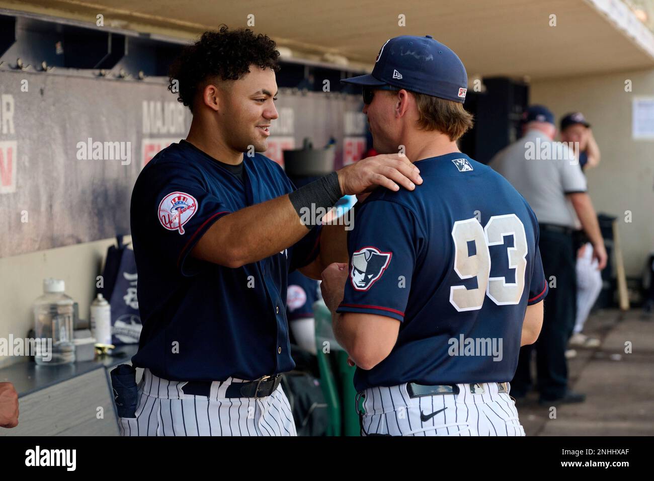Somerset Patriots Jasson Dominguez (32) talks with coach Aaron Bossi (93) during an Eastern League baseball game against the Portland Sea Dogs on September 18, 2022 at TD Bank Ballpark in Bridgewater