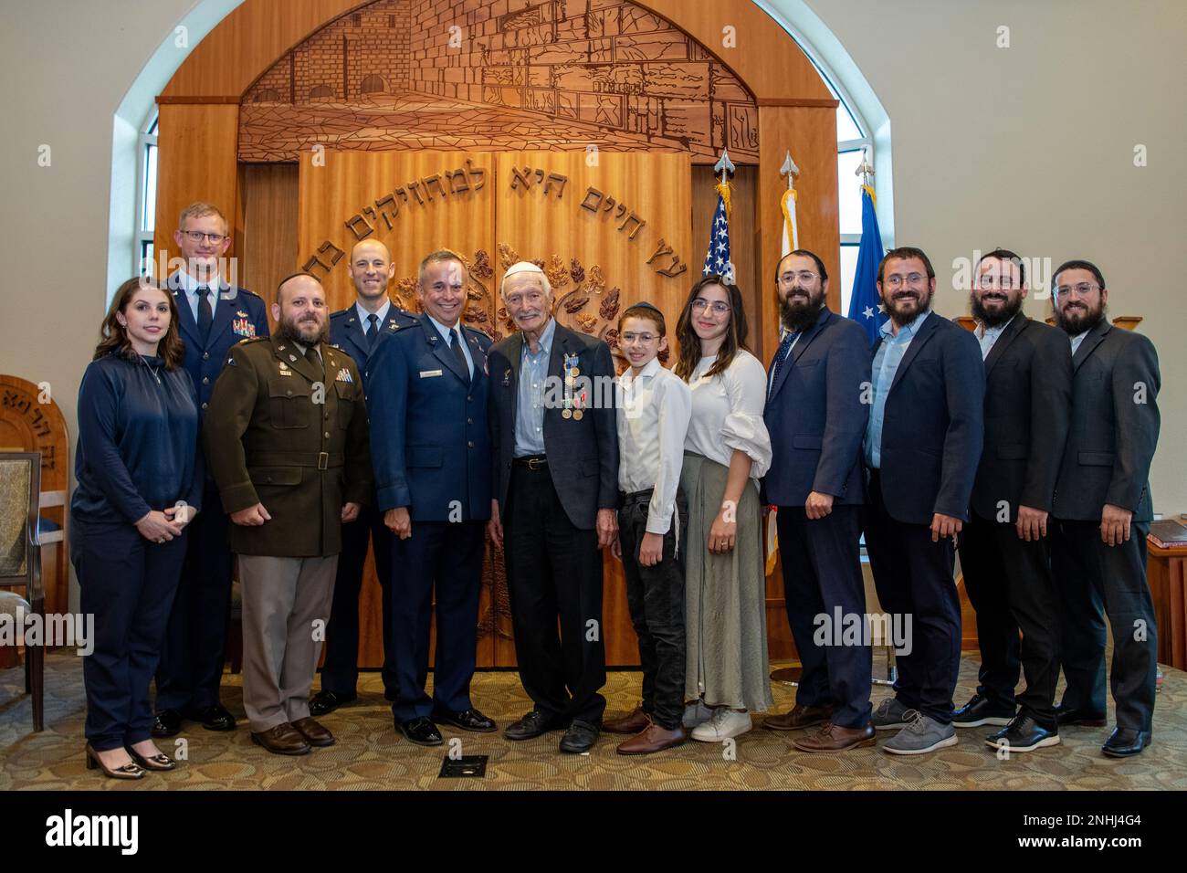 U.S. Army Air Corps 1st Lt. Gerald Teldon (center), retired, poses for a group photo after his awards ceremony for his honorable service as a pilot on July 29, 2022, at the Chabad Center for Jewish Life and Learning, San Antonio, Texas. Teldon, born in the Bronx, N.Y., in 1924, joined the military in 1944. He completed 62 missions during WWII and the Korean War. Lt. Col. Andrew Stein, 502nd Operations Support Squadron commander, was the presiding officer. The awards presented to Teldon are as follows: the Air Medal; American Campaign Medal; European – African – Middle Eastern Campaign Medal; W Stock Photo