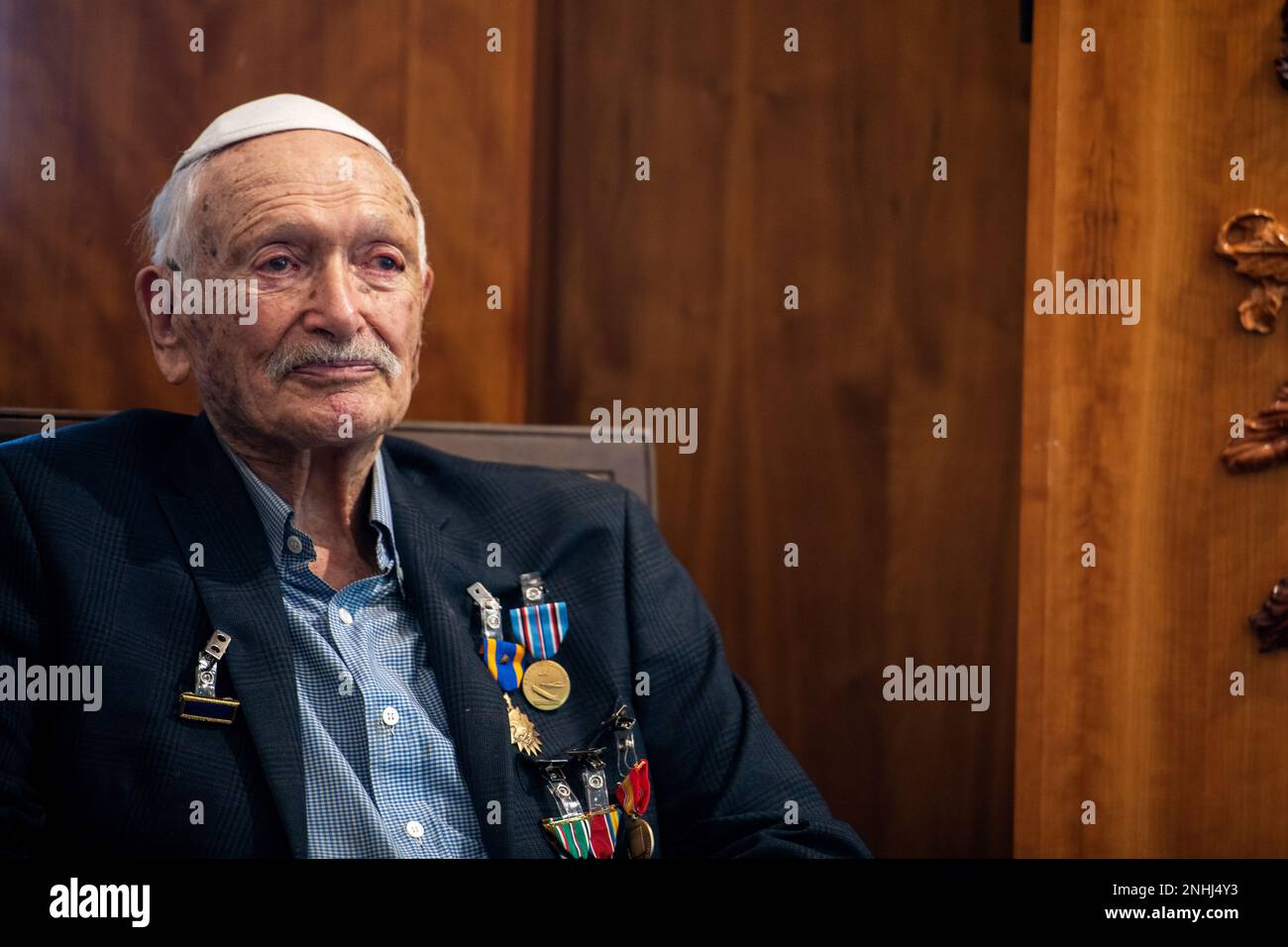 U.S. Army Air Corps 1st Lt. Gerald Teldon, retired, receives his award medals for his honorable service as a pilot on July 29, 2022, at the Chabad Center for Jewish Life and Learning, San Antonio, Texas. Teldon, born in the Bronx, N.Y., in 1924, joined the military in 1944. He completed 62 missions during WWII and the Korean War. Lt. Col. Andrew Stein, 502nd Operations Support Squadron commander, was the presiding officer. The awards presented to Teldon are as follows: the Air Medal; American Campaign Medal; European – African – Middle Eastern Campaign Medal; World War II Victory Medal; Nation Stock Photo