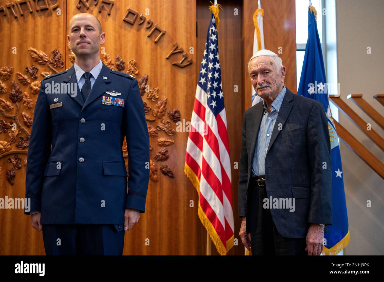 U.S. Air Force Lt. Col. Stein (left), 502nd Operations Support Squadron commander, prepares to present U.S. Army Air Corps 1st Lt. Gerald Teldon, retired, with the Air Medal for his honorable service as a pilot on July 29, 2022, at the Chabad Center for Jewish Life and Learning, San Antonio, Texas. Teldon, born in Bronx, N.Y., in 1924, joined the military in 1944. He completed 62 missions during WWII and the Korean War. Lt. Col. Andrew Stein, 502nd Operations Support Squadron commander, was the presiding officers. The awards presented to Teldon are as follows: the Air Medal; American Campaign Stock Photo