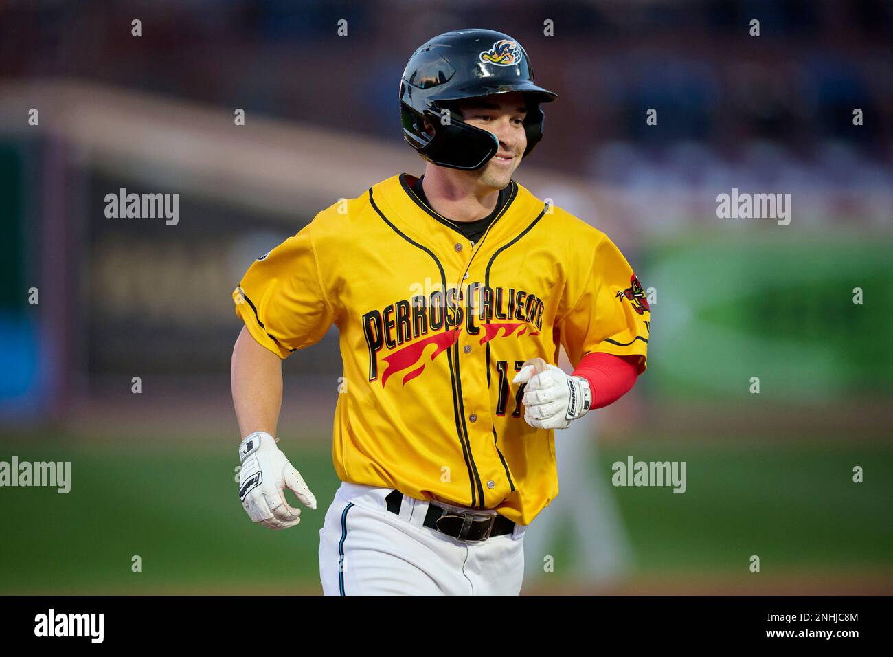 Perros Calientes De Akron Will Brennan (17) rounds the bases after