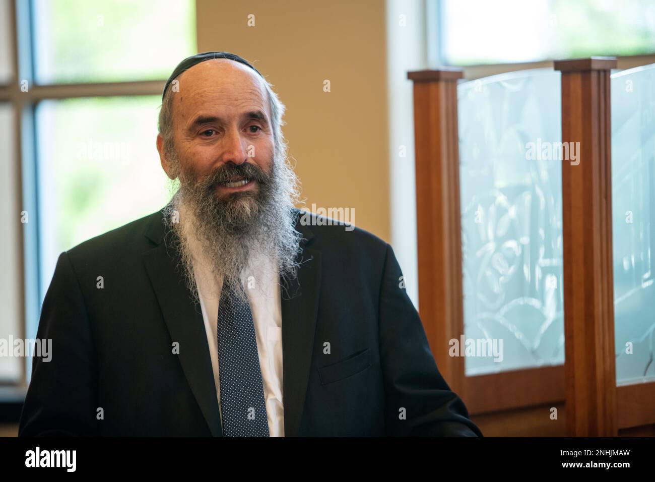 Rabbi Tuvia Teldon provides a few words during the awards ceremony of his father, U.S. Army Air Corps 1st Lt. Gerald Teldon, retired, recognizing his honorable service as a pilot on July 29, 2022, at the Chabad Center for Jewish Life and Learning, San Antonio, Texas. Teldon, born in Bronx, N.Y., in 1924, joined the military in 1944. He completed 62 missions during WWII and the Korean War. Lt. Col. Andrew Stein, 502nd Operations Support Squadron commander, was the presiding officers. The awards presented to Teldon are as follows: the Air Medal; American Campaign Medal; European – African – Midd Stock Photo