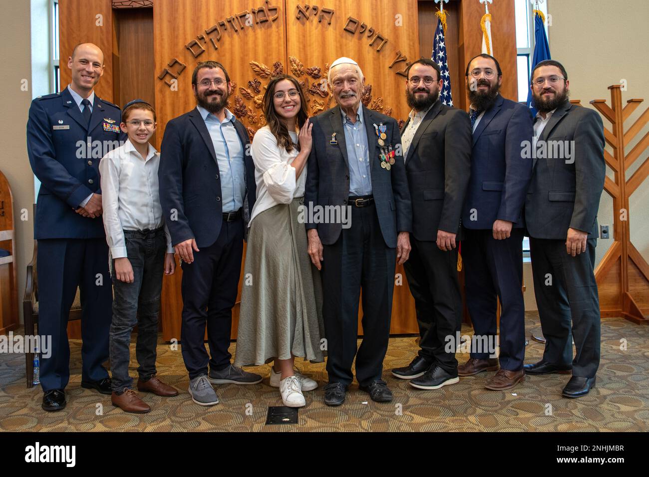 U.S. Army Air Corps 1st Lt. Gerald Teldon (center), retired, poses for a group photo after his awards ceremony for his honorable service as a pilot on July 29, 2022, at the Chabad Center for Jewish Life and Learning, San Antonio, Texas. Teldon, born in Bronx, N.Y., in 1924, joined the military in 1944. He completed 62 missions during WWII and the Korean War. Lt. Col. Andrew Stein, 502nd Operations Support Squadron commander, was the presiding officers. The awards presented to Teldon are as follows: the Air Medal; American Campaign Medal; European – African – Middle Eastern Campaign Medal; Worl Stock Photo