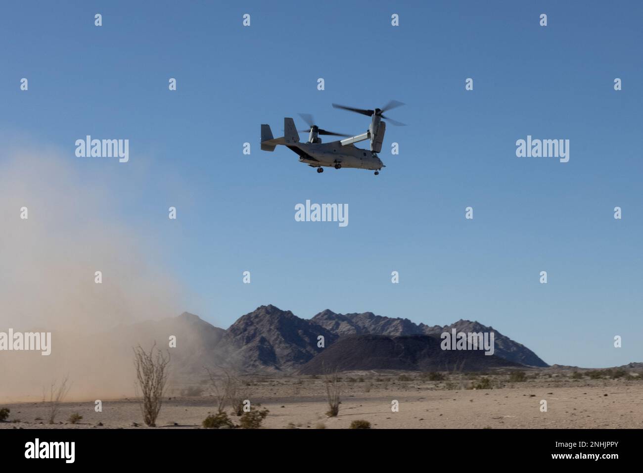 An MV-22B Osprey assigned to Marine Medium Tiltrotor Squadron (VMM) 261 flies over Marine Corps Air Ground Combat Center Twentynine Palms, California, Feb. 15, 2023. VMM-261 trained to support Marine ground units during Service Level Training Exercise 2-23, a series of exercises designed to prepare Marines for operations around the globe. VMM-261 is a subordinate unit of 2nd Marine Aircraft Wing, the aviation combat element of II Marine Expeditionary Force. (U.S. Marine Corps photo by Lance Cpl. Orlanys Diaz Figueroa) Stock Photo