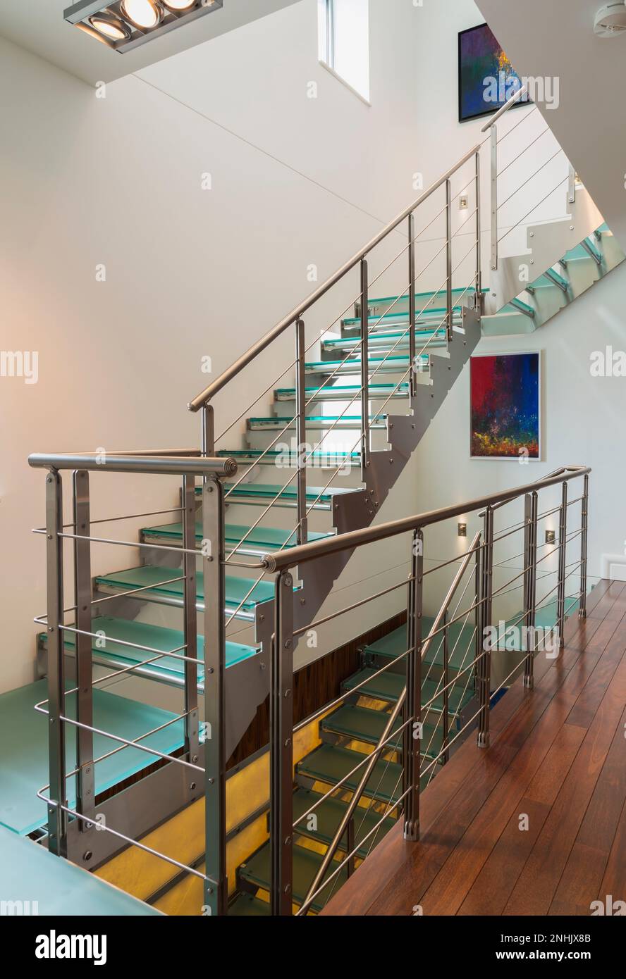 Steel and tempered glass staircase and hallway with exotic wood plank ...