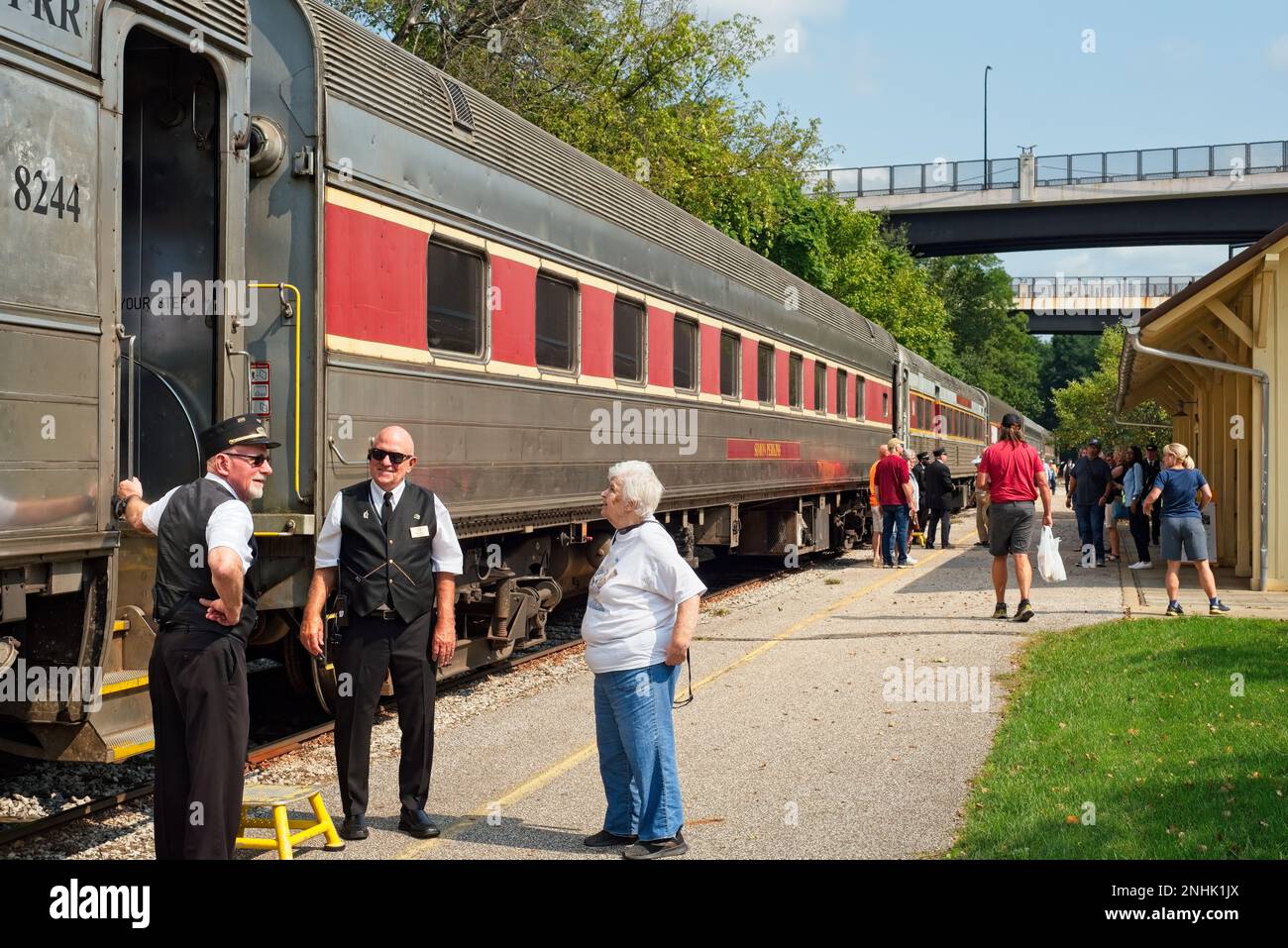 Akron, OH, USA - September 15, 2022: Passengers and crew on a Cuyahoga Valley Scenic Railroad train stretch their legs during a stop at Akron Northsid Stock Photo