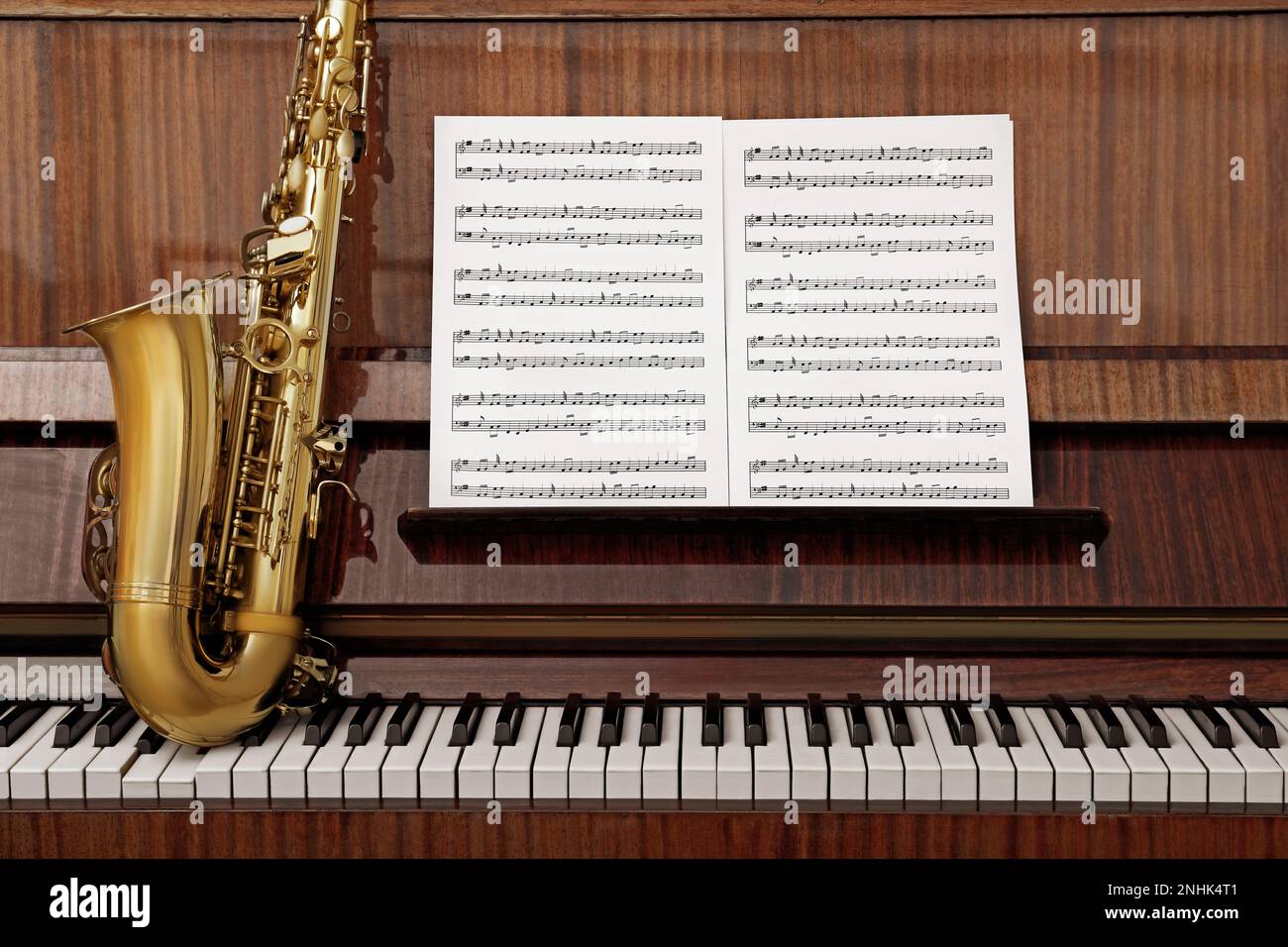 Beautiful saxophone on piano keys. Musical instruments Stock Photo Alamy