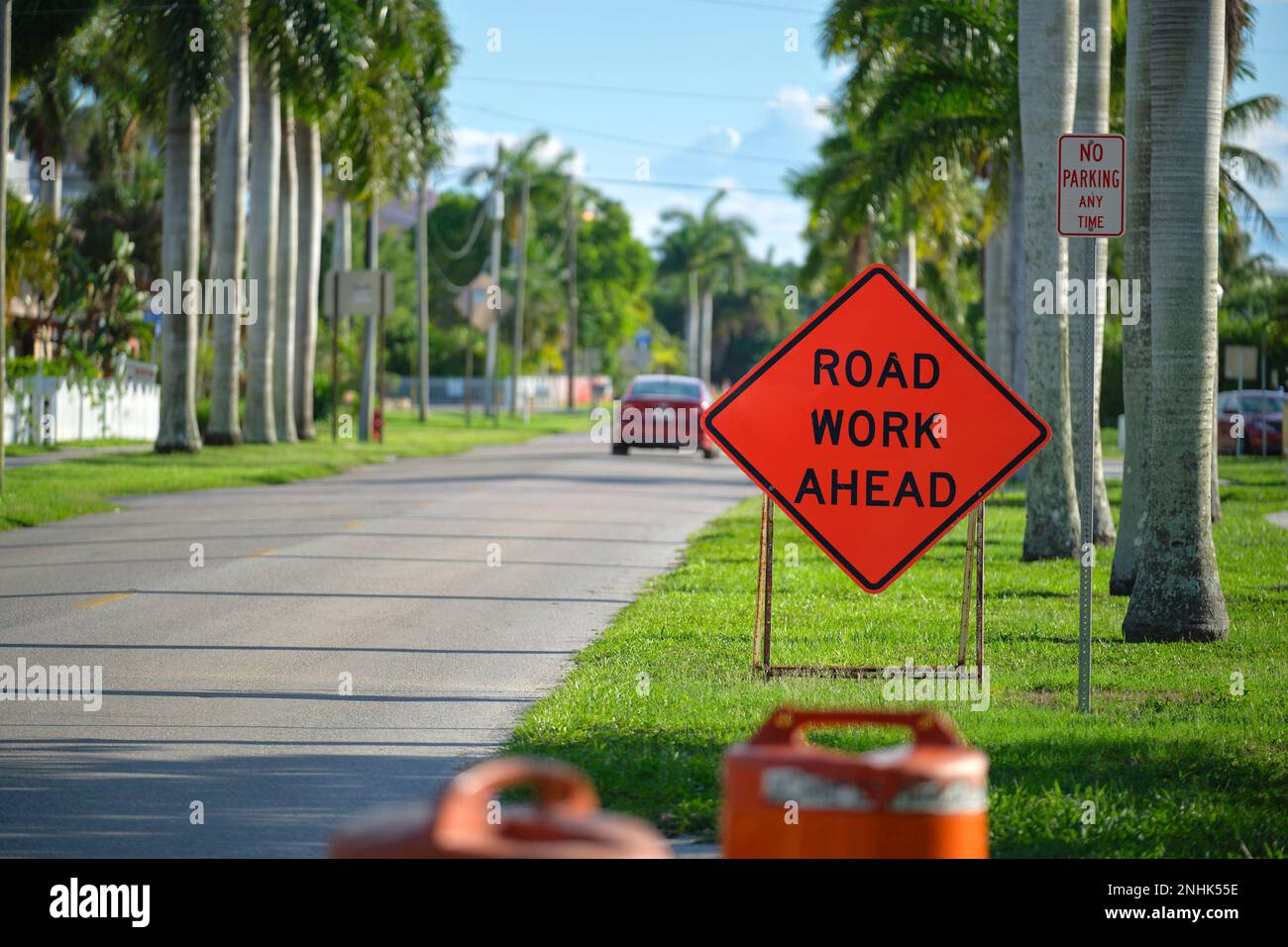 Road work ahead sign on street site as warning to cars about