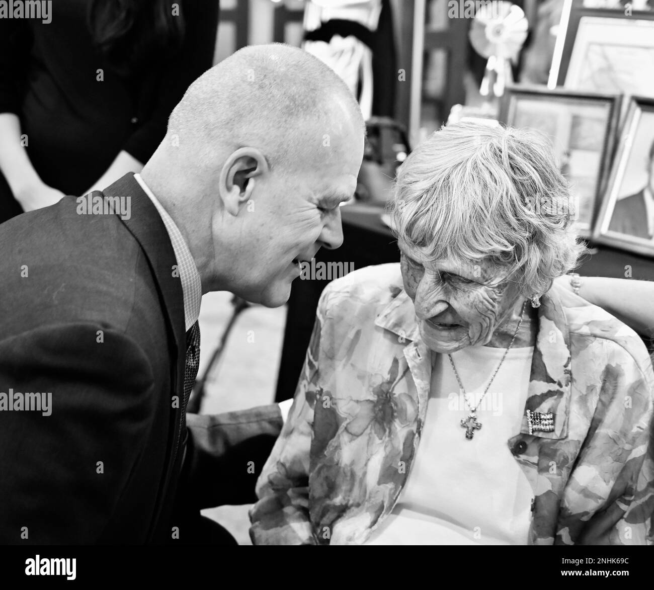 Sixteenth Chief Master Sgt. of the Air Force James A. Roy speaks with Kathleen McCoy, spouse of