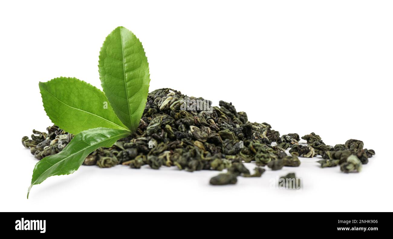 Dry green tea and fresh leaves on white background Stock Photo - Alamy