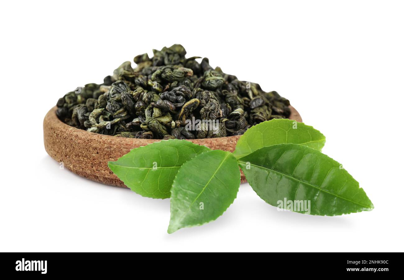 Dry green tea and fresh leaves on white background Stock Photo - Alamy