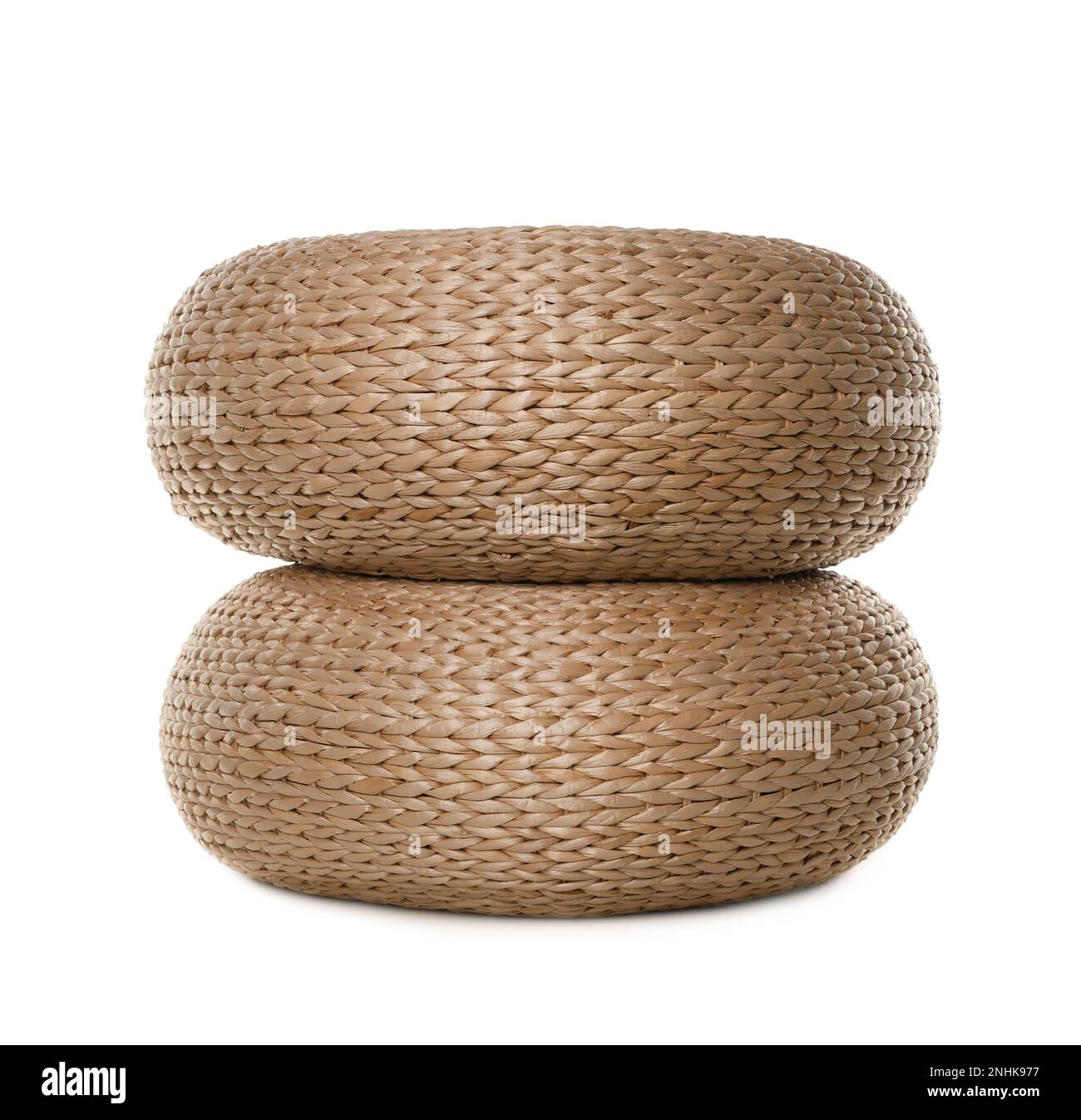 Two stylish wicker poufs on white background Stock Photo