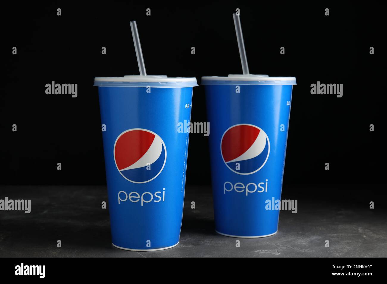 MYKOLAIV, UKRAINE - JUNE 9, 2021: Paper Pepsi cups on grey table ...