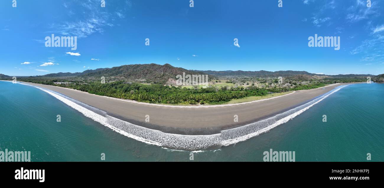 Lush Tropical coastline with rocks and blue water in Costa Rica near ...