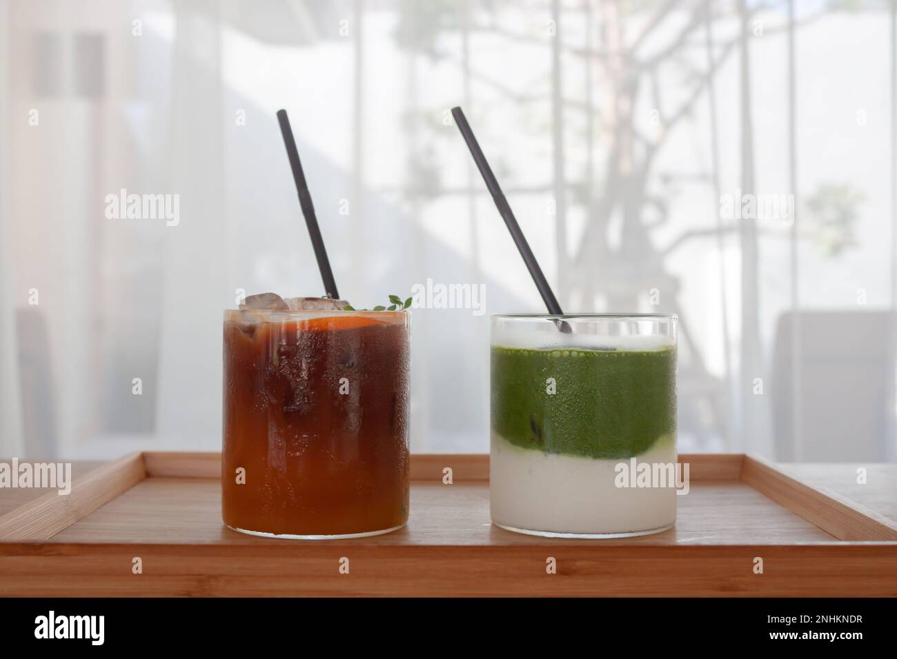 Iced americano with orange and iced matcha green tea in coffee shop, stock photo Stock Photo