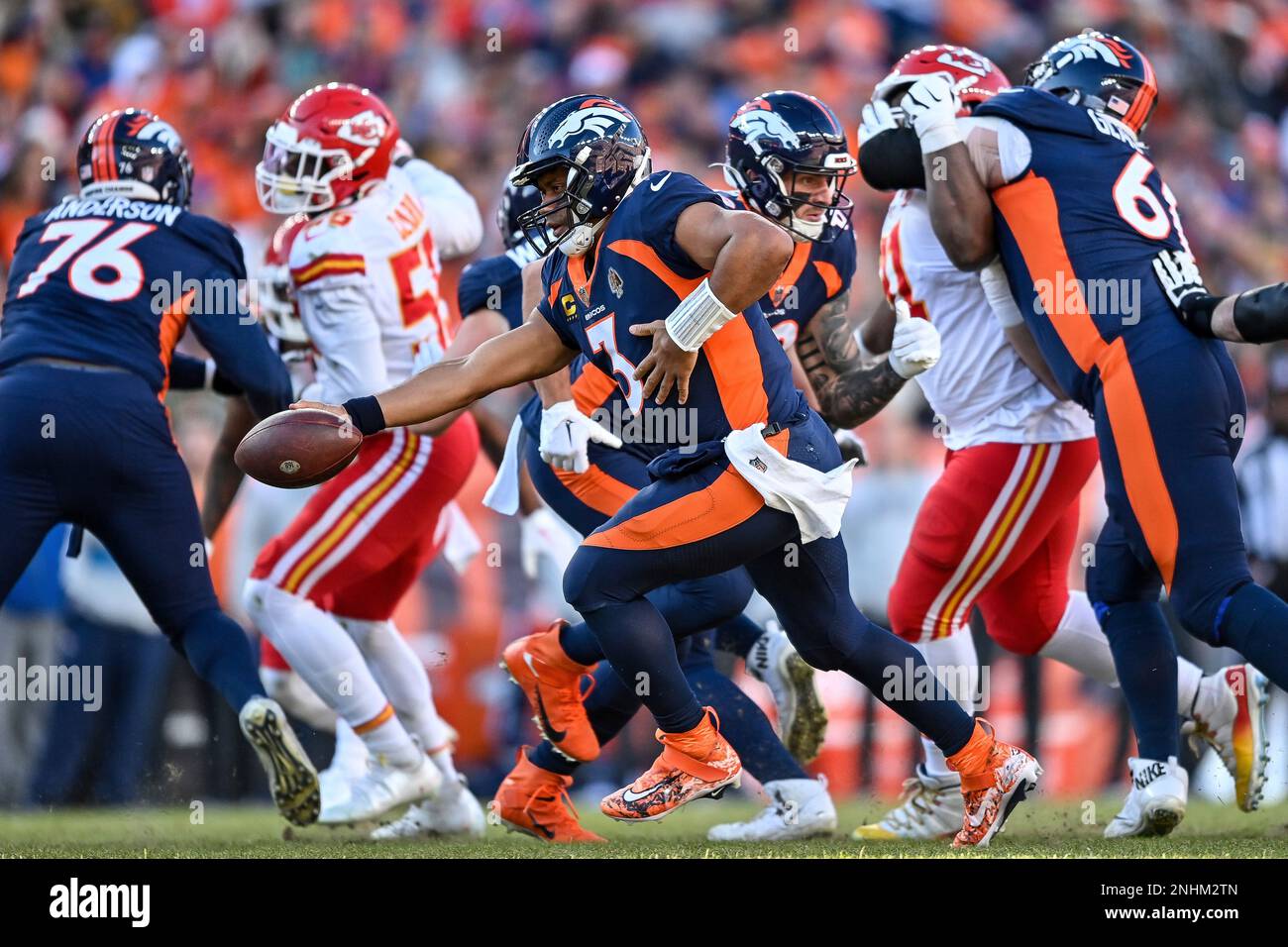 DENVER, CO - DECEMBER 11: Denver Broncos quarterback Russell Wilson (3)  sets to hand off in the second quarter during a game between the Kansas  City Chiefs and the Denver Broncos at