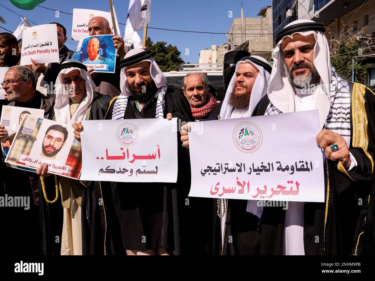 Gaza, Palestine. 31st Mar, 2018. Palestinians carry portraits of prisoners and placards expressing their opinion during a demonstration in support of Palestinian prisoners inside Israeli prisons. (Credit Image: © Yousef Masoud/SOPA Images via ZUMA Press Wire) EDITORIAL USAGE ONLY! Not for Commercial USAGE! Stock Photo