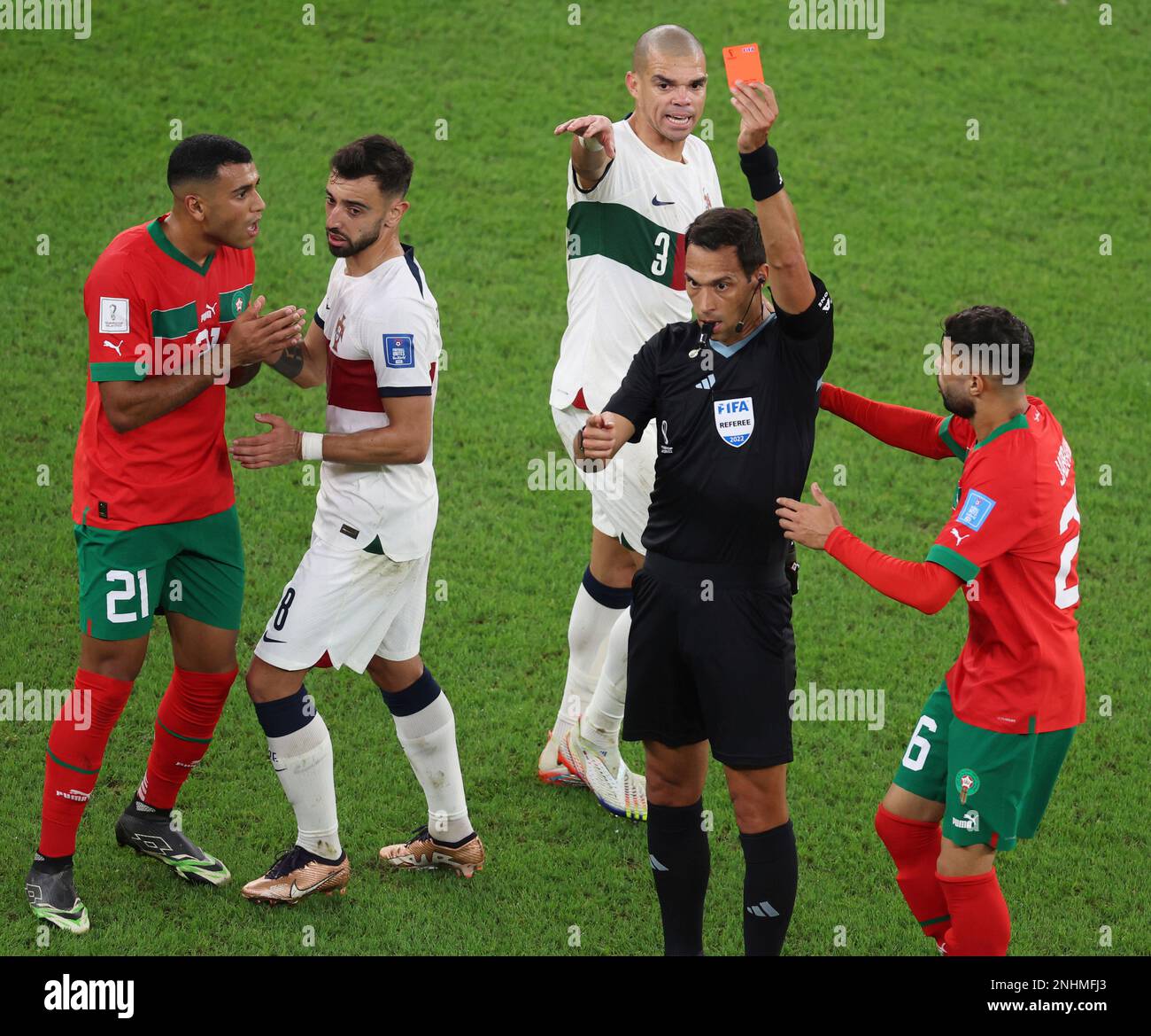 Referee Facundo Tello (R2) shows a red card to Morocco's Walid Cheddira