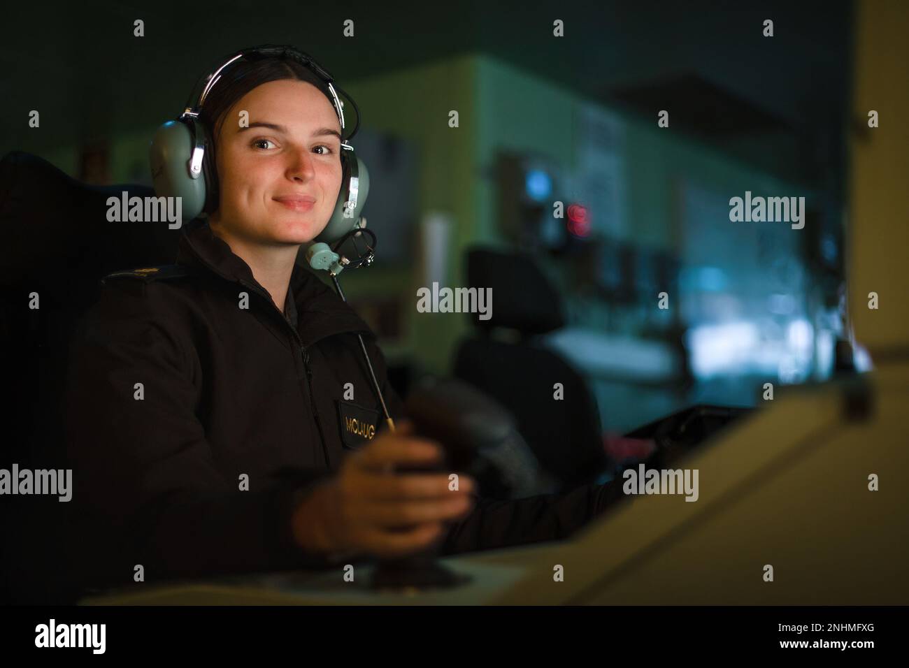 PACIFIC OCEAN (July 30, 2022) Royal Australian Navy Able Seaman Combat Systems Operator Miranda McLaughlin operates the combat system consoles in the Operations Room aboard Royal Australian Navy Canberra-class landing helicopter dock HMAS Canberra (L02) during Rim of the Pacific (RIMPAC) 2022. Twenty-six nations, 38 ships, three submarines, more than 170 aircraft and 25,000 personnel are participating in RIMPAC from June 29 to Aug. 4 in and around the Hawaiian Islands and Southern California. The world's largest international maritime exercise, RIMPAC provides a unique training opportunity whi Stock Photo