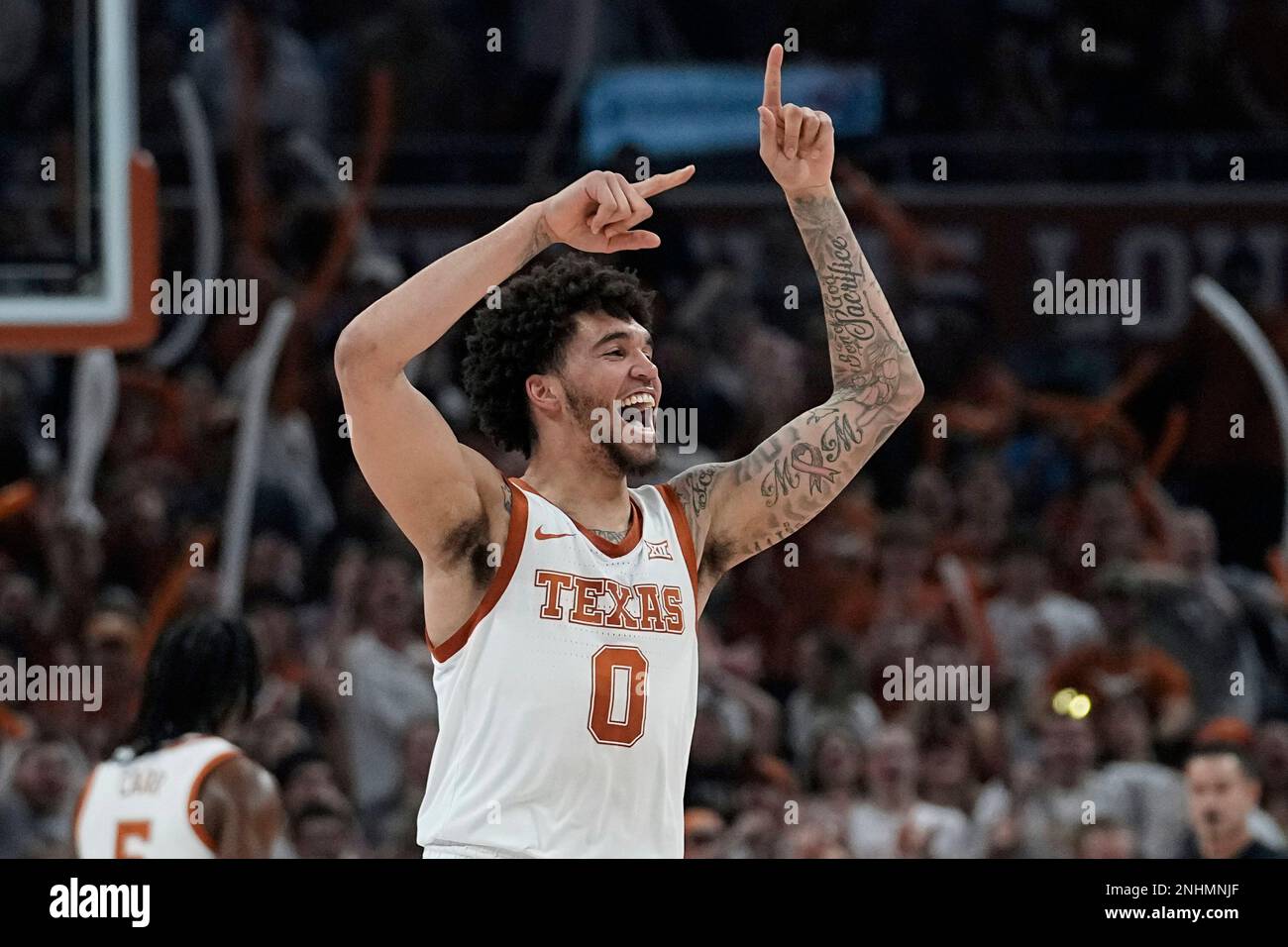 Texas forward Timmy Allen celebrates a score against Iowa State during