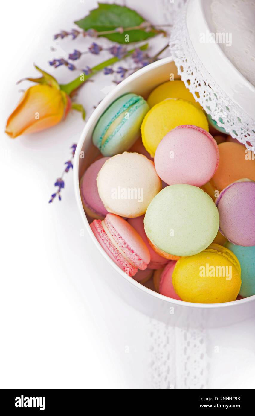 Colorful macaroons in a gift box on a white table Stock Photo