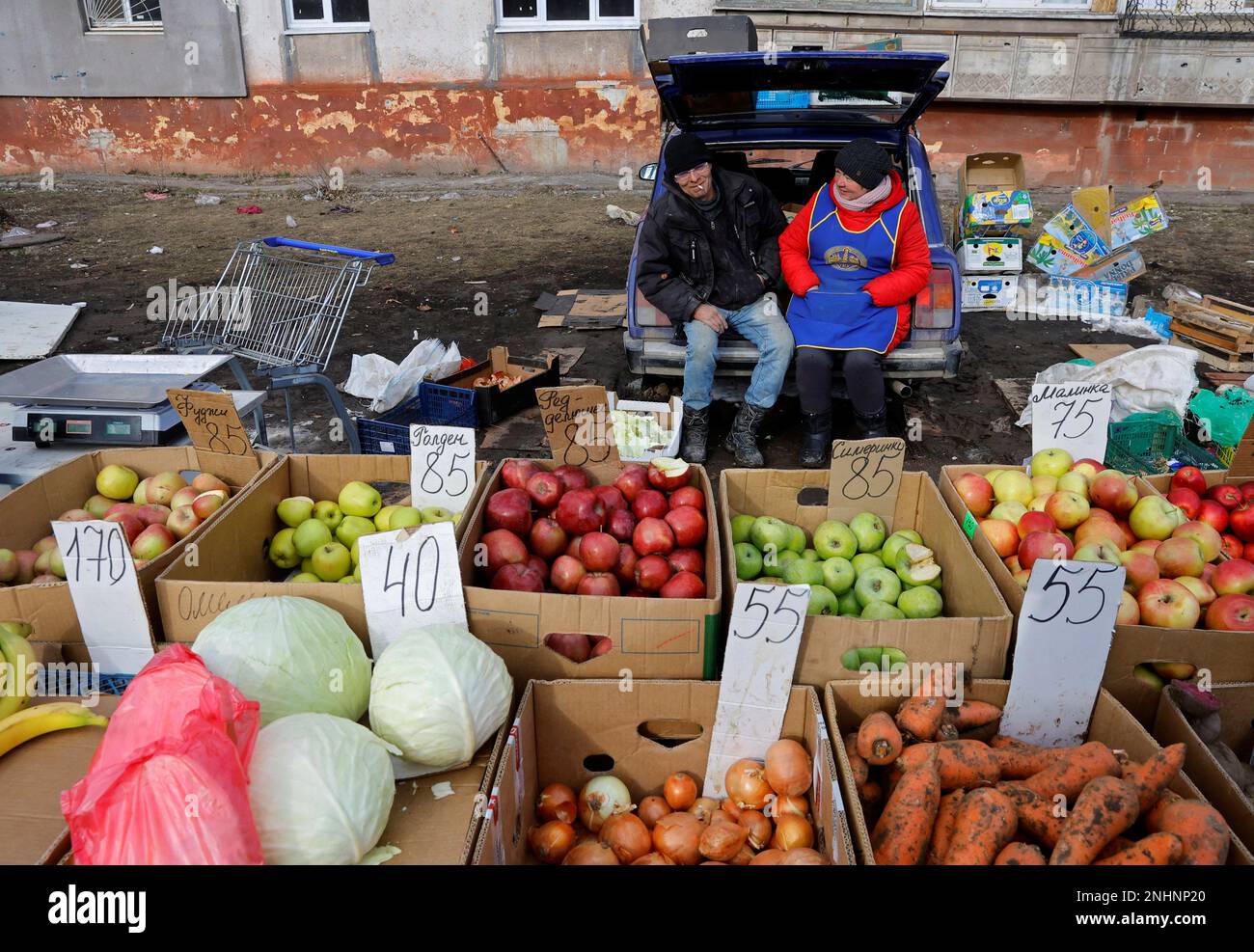 Vendors sell fruits and vegetables at a local market in the course of Russia-Ukraine conflict in Mariupol, Russian-controlled Ukraine, February 16, 2023. REUTERS/Alexander Ermochenko Stock Photo