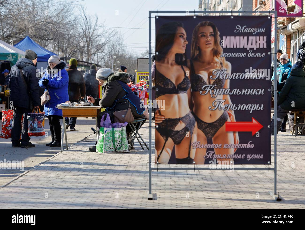 A view shows an advertising banner at a local market in the course of Russia-Ukraine conflict in Mariupol, Russian-controlled Ukraine, February 11, 2023. REUTERS/Alexander Ermochenko Stock Photo