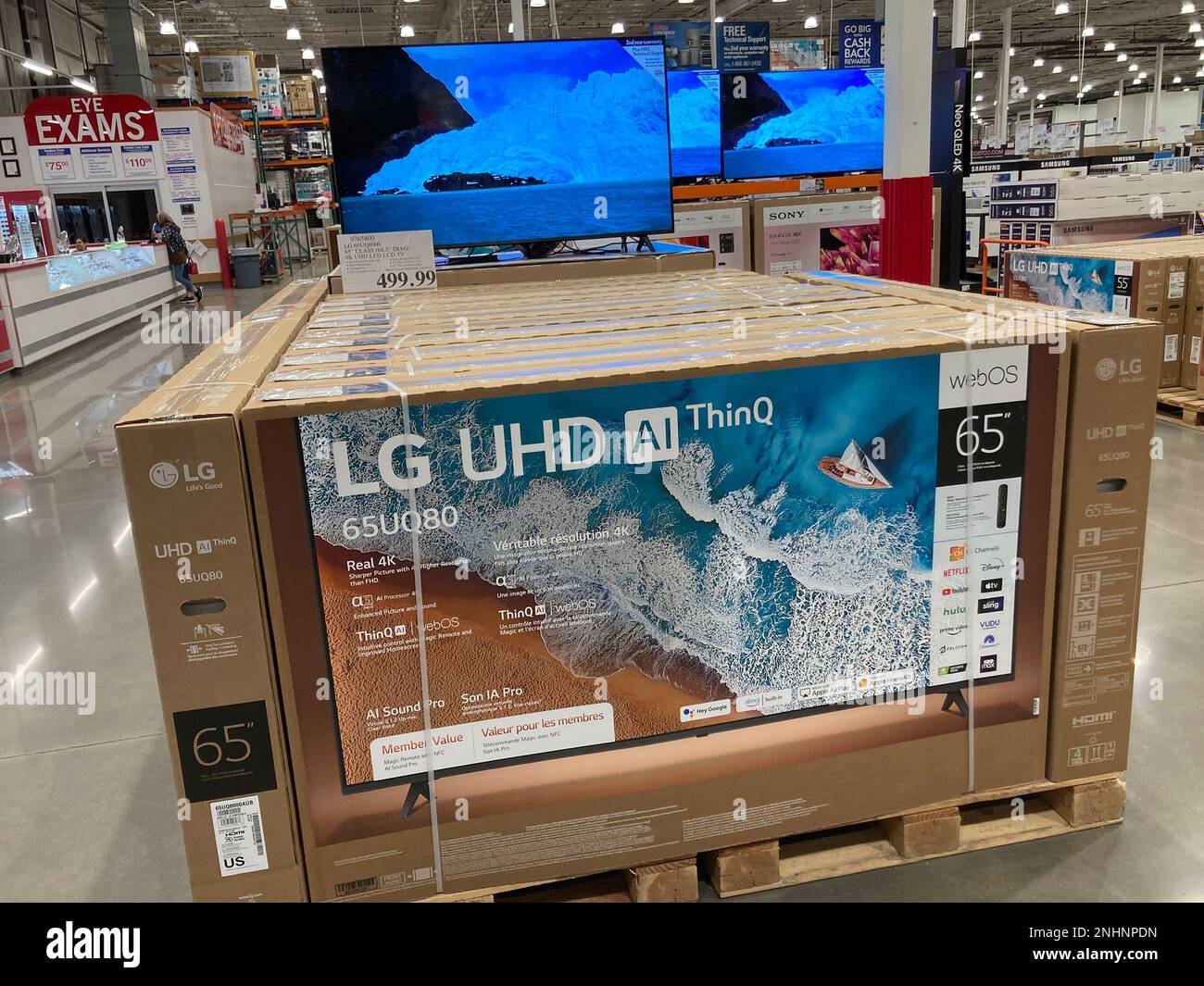 Bigscreen televisions sit on display in a Costco warehouse Monday, Feb