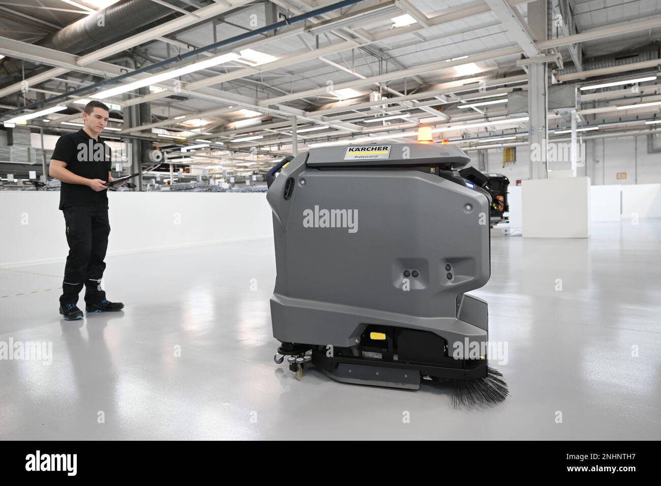 Winnenden, Germany. 20th Feb, 2023. An employee of Alfred Kärcher SE & Co.  KG checks a