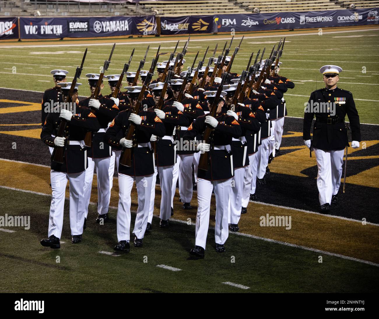 Marines with the Silent Drill Platoon march off the parade field after