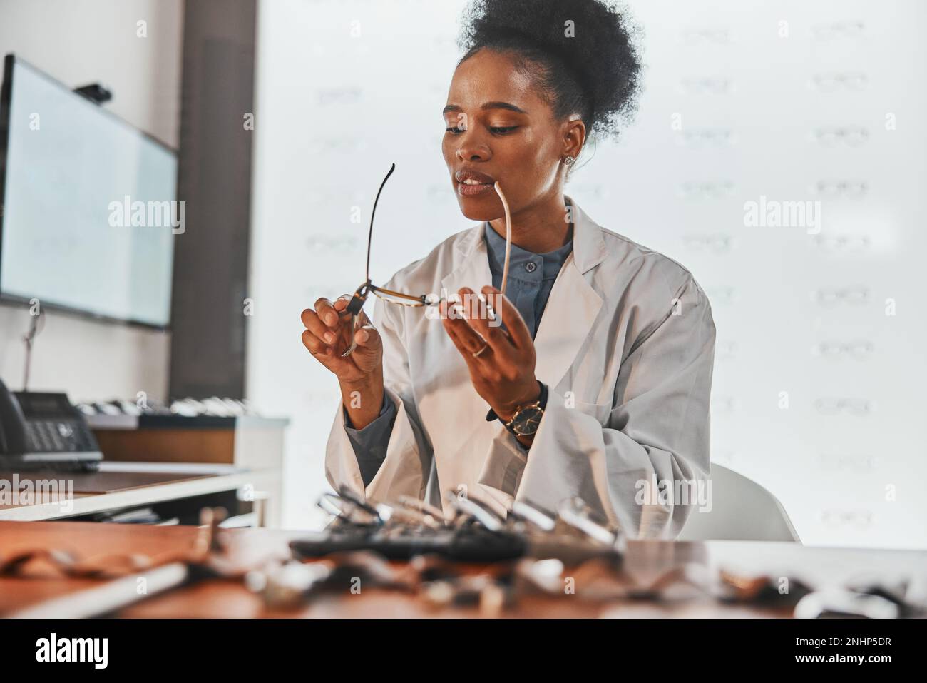 Optometry, repair and optometrist fixing glasses for prescription frame