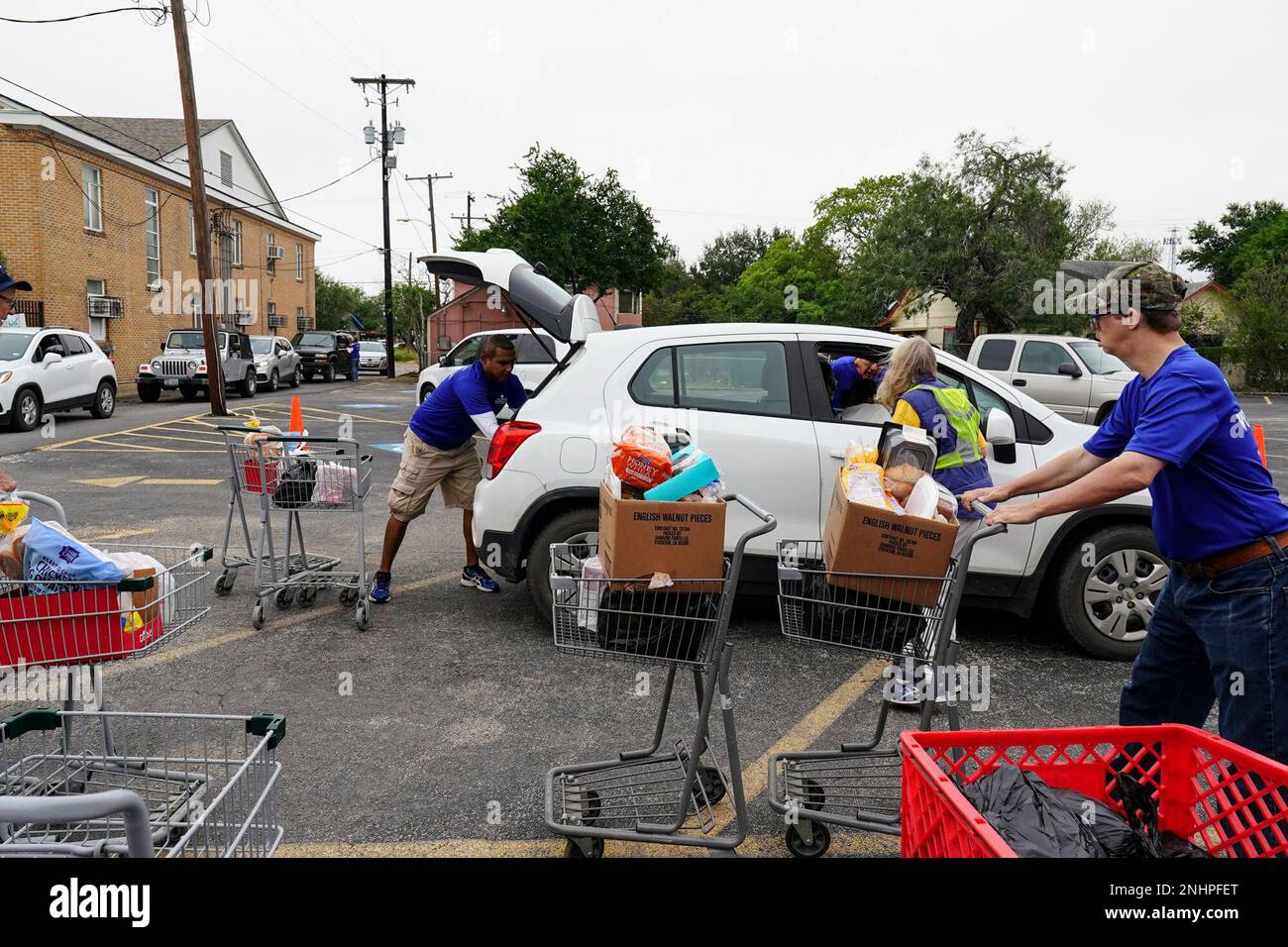 Volunteers Eric Garcia, Corynne Matteson and Bradley Ard work together