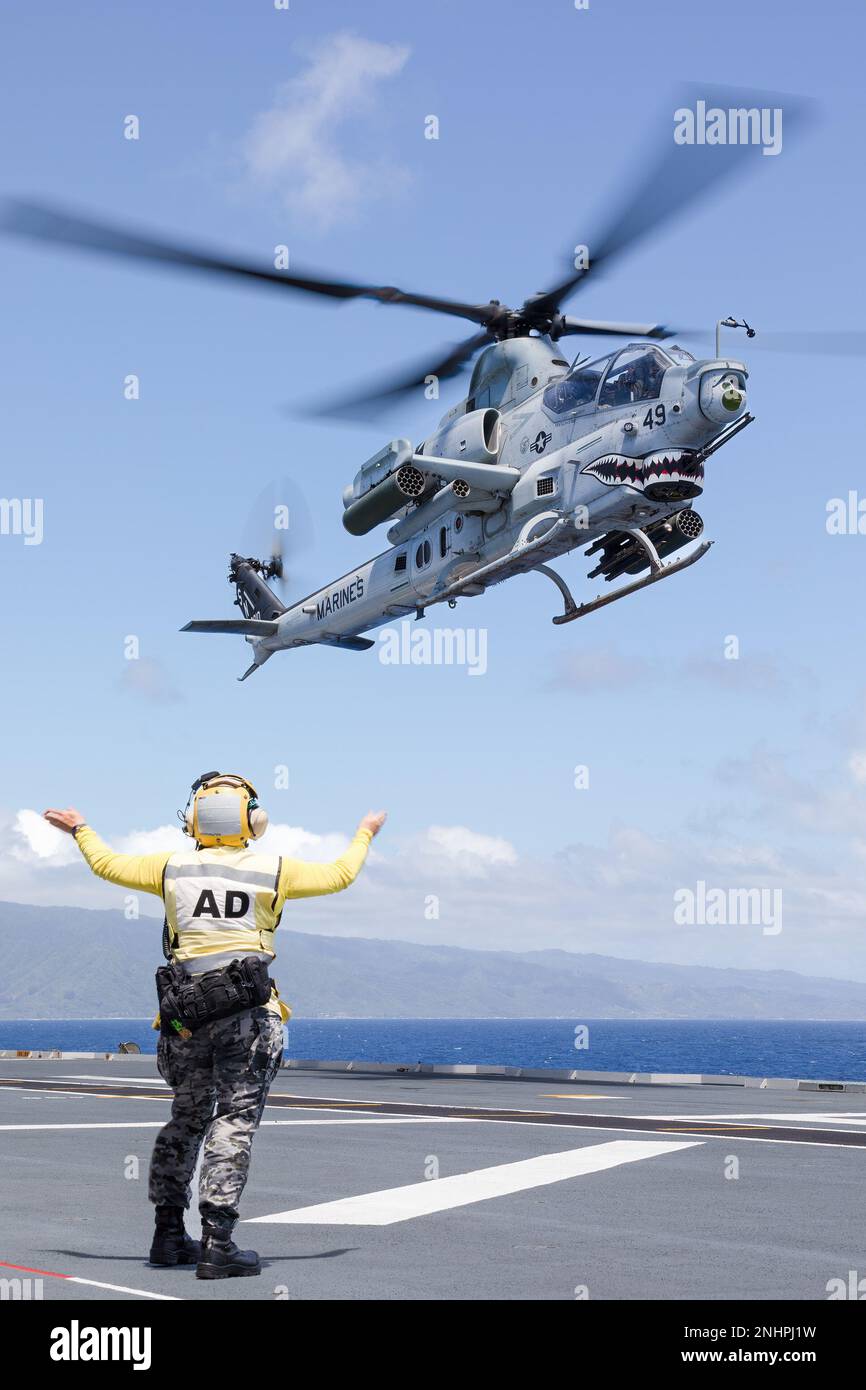 PACIFIC OCEAN (Aug. 1, 2022) A U.S. Marine Corps AH-1Z Viper helicopter prepares to land on the flight deck of Royal Australian Navy Canberra-class landing helicopter dock HMAS Canberra (L02) during Rim of the Pacific (RIMPAC) 2022. Twenty-six nations, 38 ships, three submarines, more than 170 aircraft and 25,000 personnel are participating in RIMPAC from June 29 to Aug. 4 in and around the Hawaiian Islands and Southern California. The world's largest international maritime exercise, RIMPAC provides a unique training opportunity while fostering and sustaining cooperative relationships among pa Stock Photo