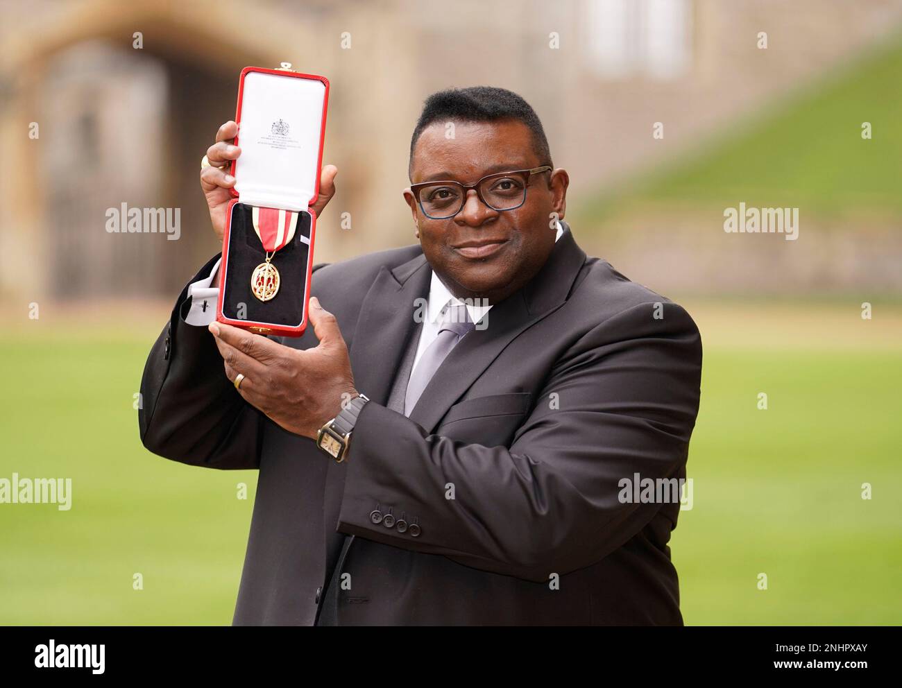 British artist and filmmaker Isaac Julien poses with his award after